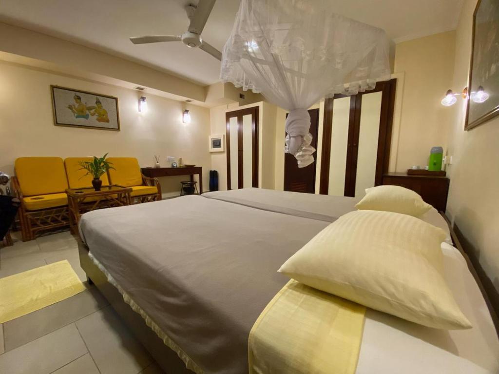 Giường trong phòng chung tại Ayurveda Spring Of Life