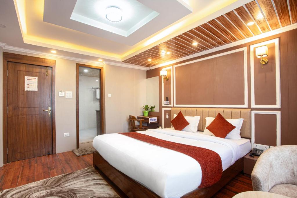 a bedroom with a large bed in a room at Hotel Airport Deepshree in Kathmandu