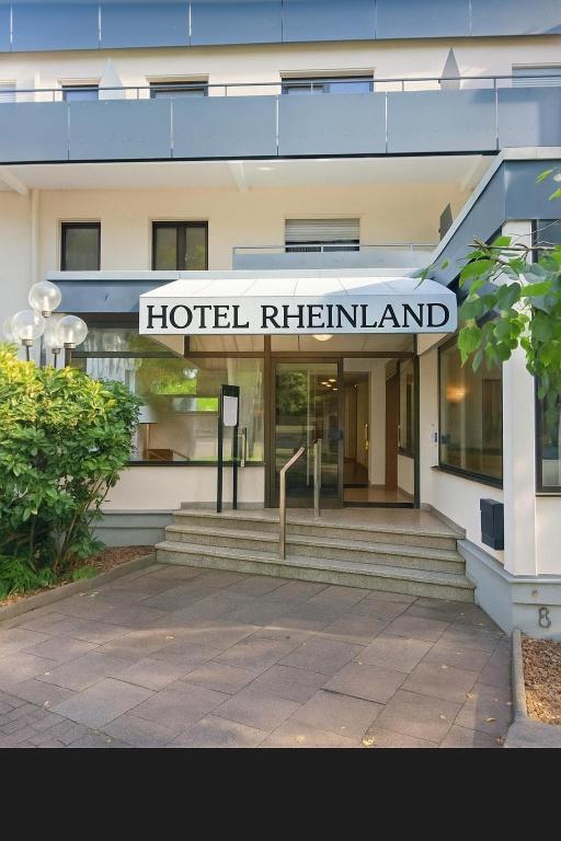 a hotel returnland sign on the front of a building at Hotel Rheinland in Bad Orb