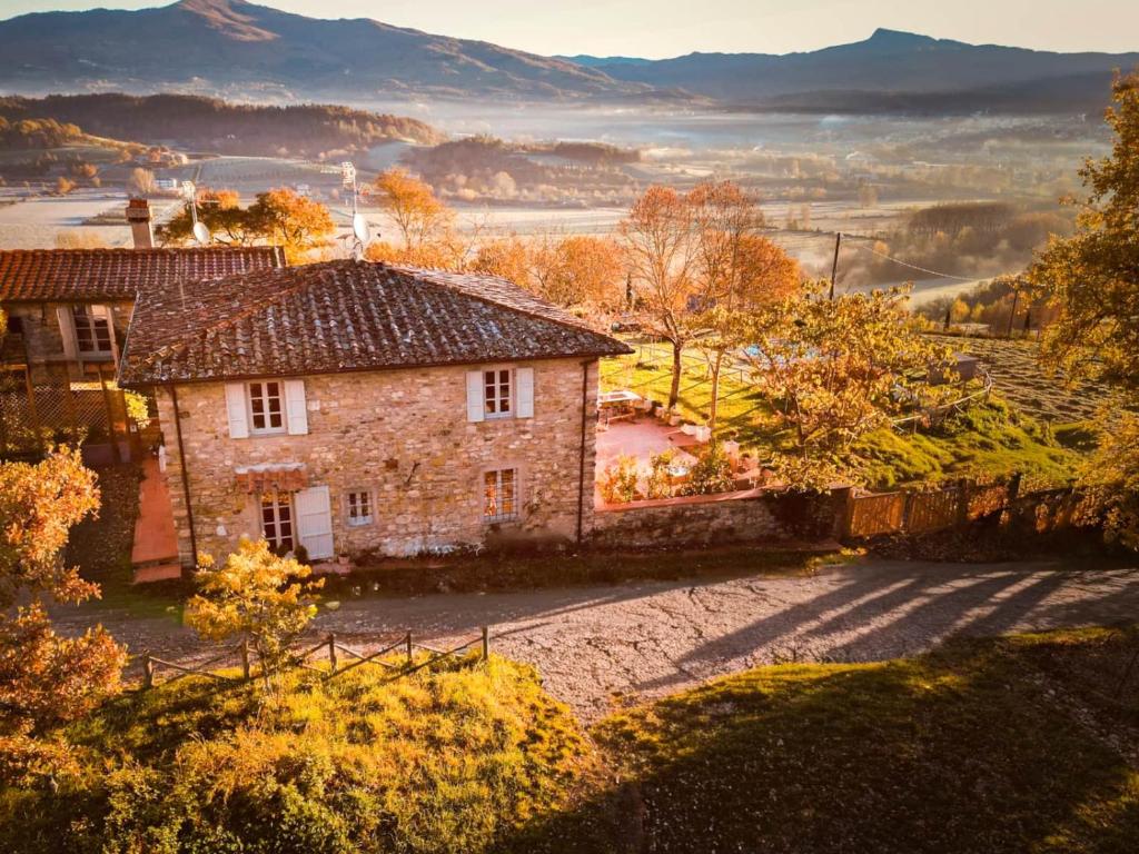 an old stone house on a hill with a view at Tenuta Seriole in Poppi