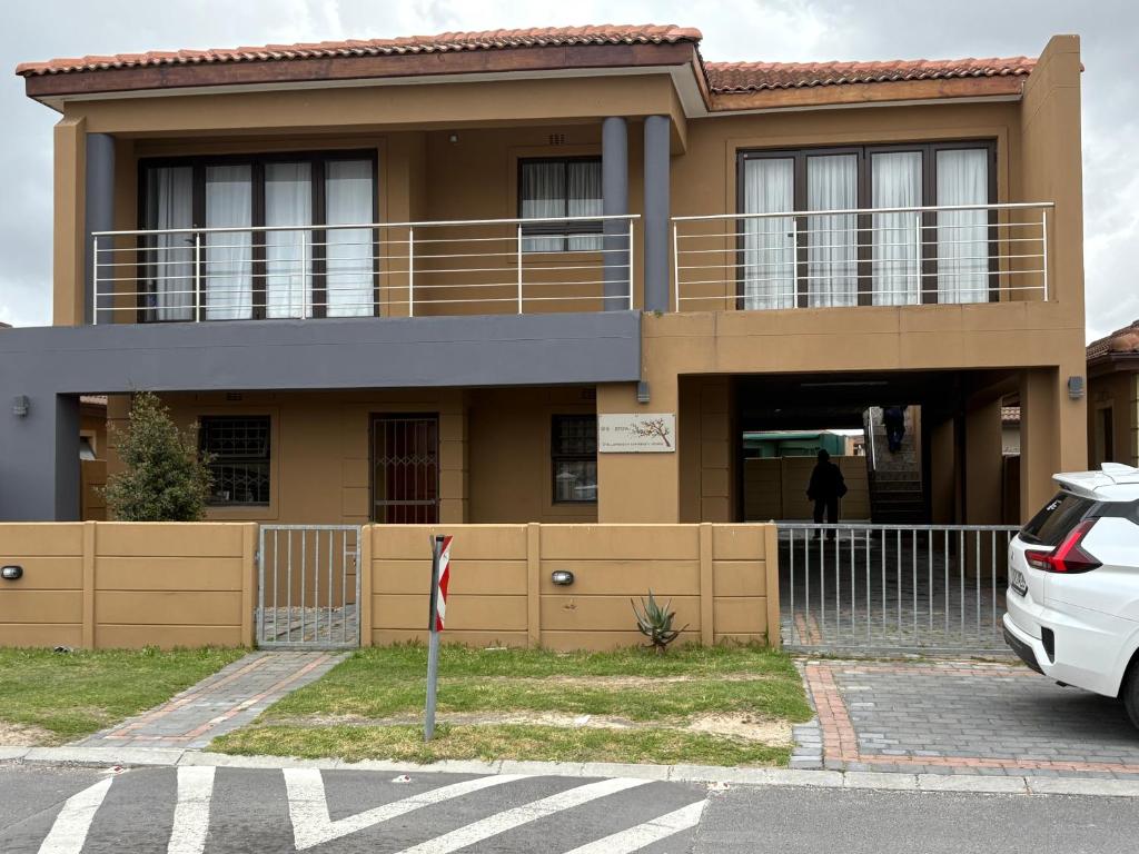 a house with a car parked in front of it at SNE Travellers in Faure
