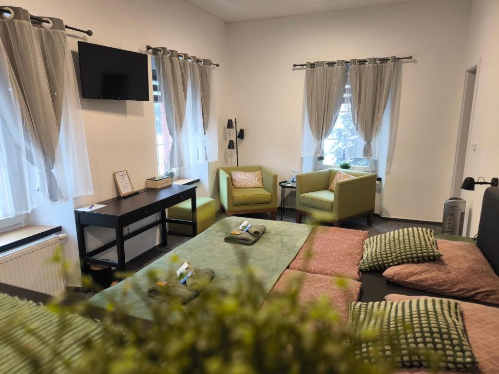 a living room with a couch and a table at B&B Royal Liberty in Ústí nad Labem