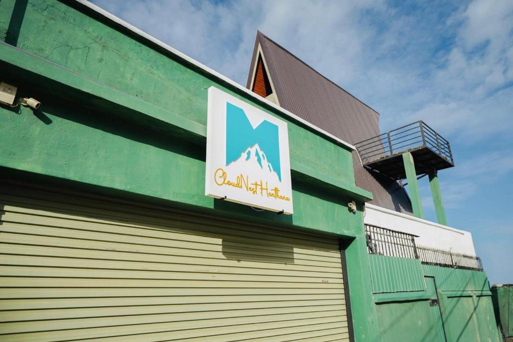 a sign on the side of a building at Cloud Nest Hanthana in Kandy