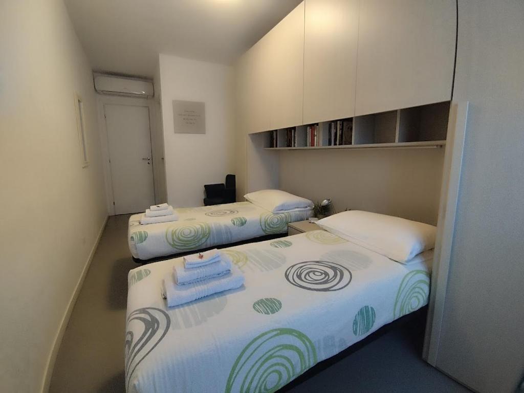 Ένα ή περισσότερα κρεβάτια σε δωμάτιο στο Assago Forum Apartment