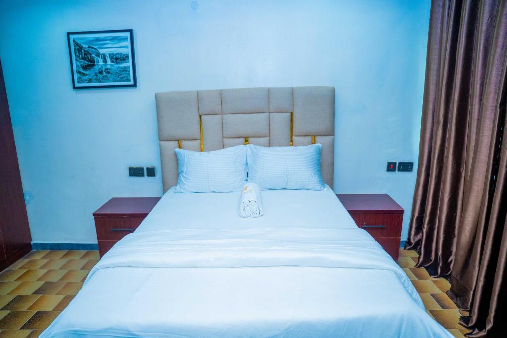 Ένα ή περισσότερα κρεβάτια σε δωμάτιο στο Spacious 4-Bedroom Apartment for families & groups