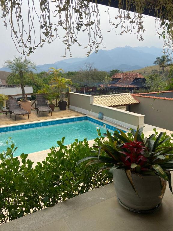 a view of a swimming pool from a house at Casa Penedo Vista da Serra in Itatiaia