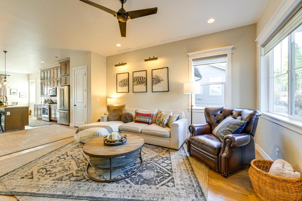a living room with two couches and a table at Hot Tub and Fire Pit Modern Flagstaff Home in Flagstaff