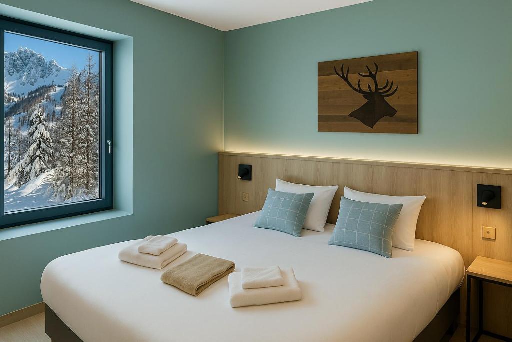 Postel nebo postele na pokoji v ubytování SOWELL HÔTEL L'Alpe Blanche