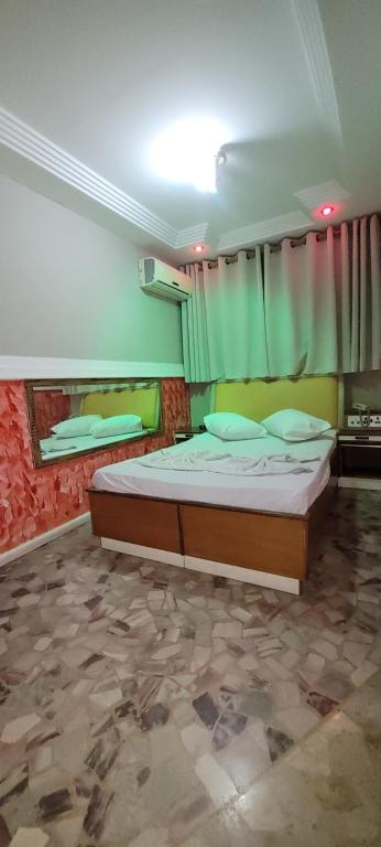 Postel nebo postele na pokoji v ubytování Hotel Centro Leste