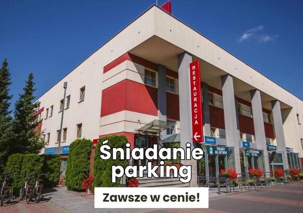 a building with a sign in front of it at Eurohotel Swarzędz in Swarzędz