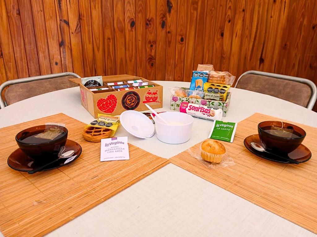 a table with food and a box on top of it at Depto 1615 in Villa Mercedes