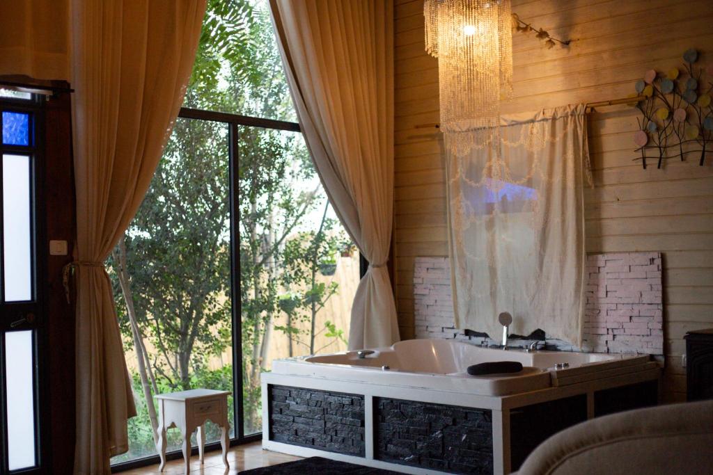 a bathroom with a sink and a large window at צימר תומר דבורה-קצה ההר in Kerem Ben Zimra