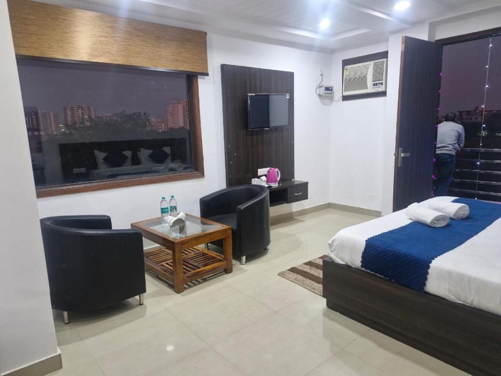 Voodi või voodid majutusasutuse Yashobhoomi Grand toas