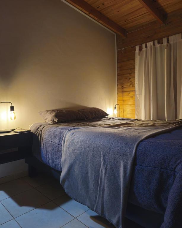 En eller flere senge i et værelse på Lagunas de la selva