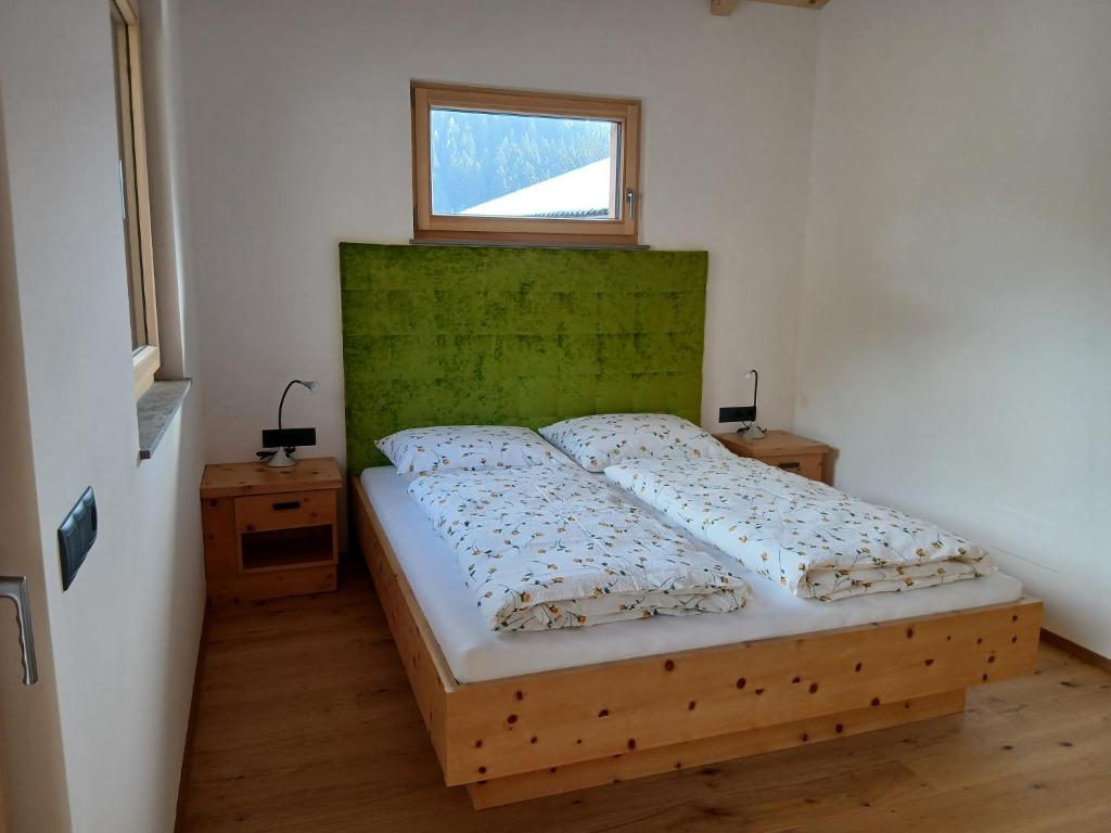 Ένα ή περισσότερα κρεβάτια σε δωμάτιο στο Reitererhof