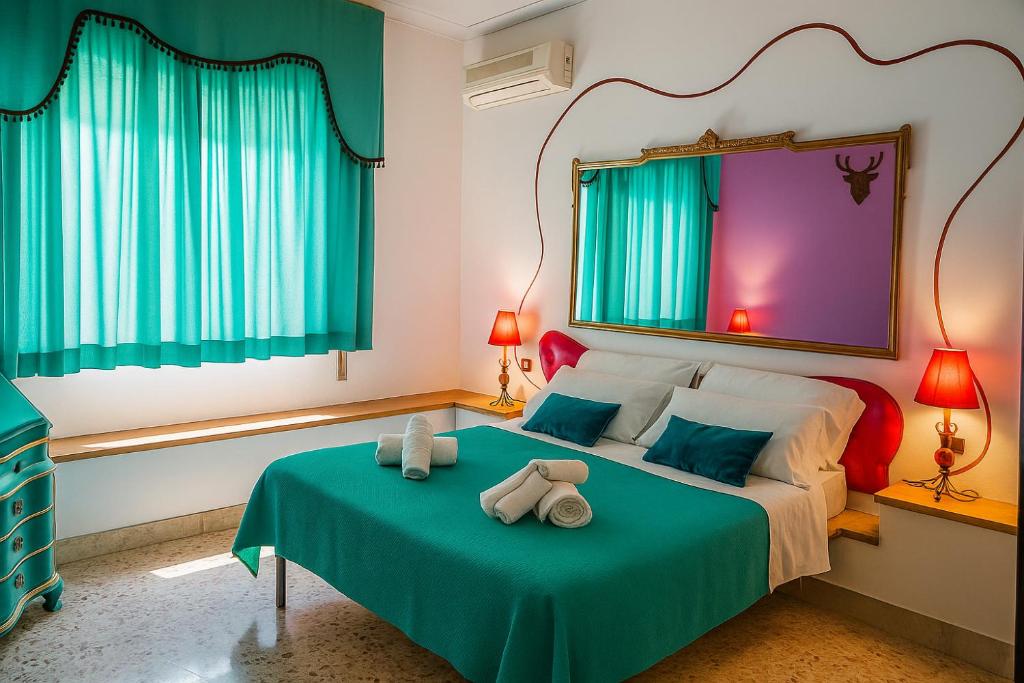 Ένα ή περισσότερα κρεβάτια σε δωμάτιο στο Hotiday Palermo Agostino