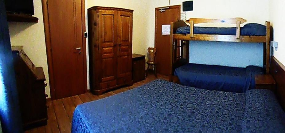 Postel nebo postele na pokoji v ubytování Albergo Delle Alpi