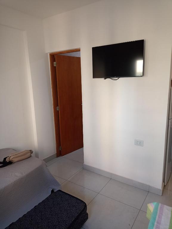 a room with a flat screen tv on a wall at Monoambiente centrico in Santiago del Estero
