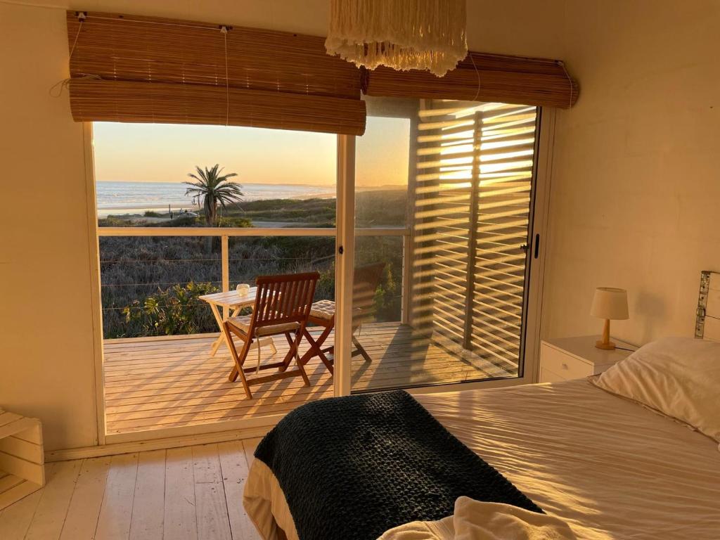 En eller flere senge i et værelse på Altamar Casas de playa -Casas