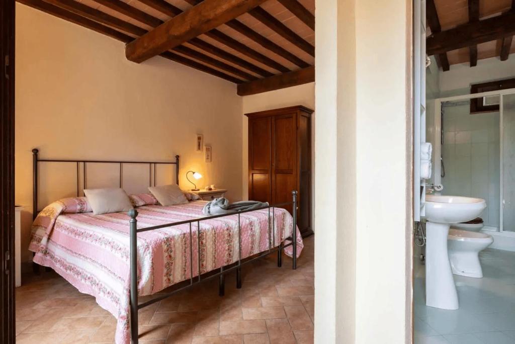 Giường trong phòng chung tại Hotiday Massa Marittima