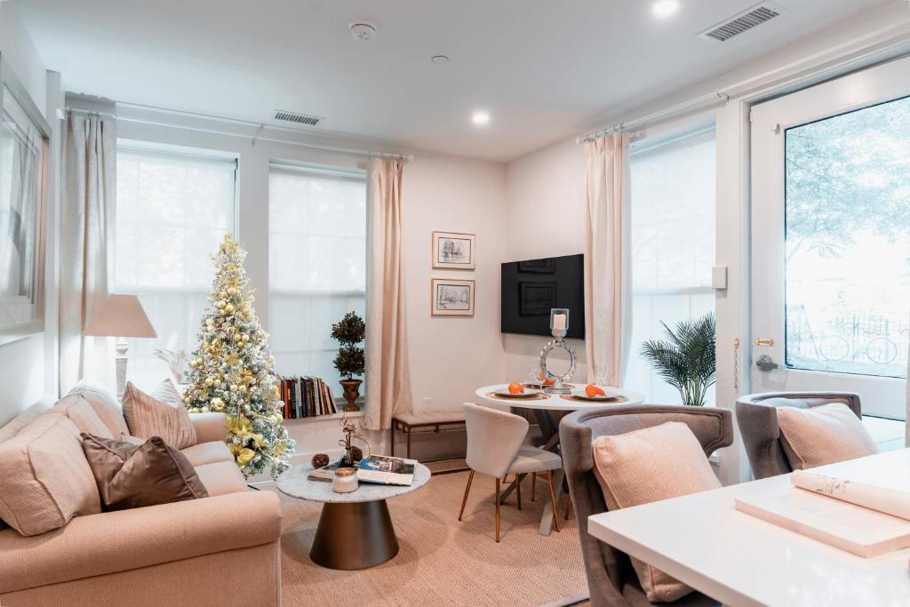 a living room with a christmas tree in it at Sunny 2BR Apt with Kitchen & Parking, Near Brown & RISD in Providence