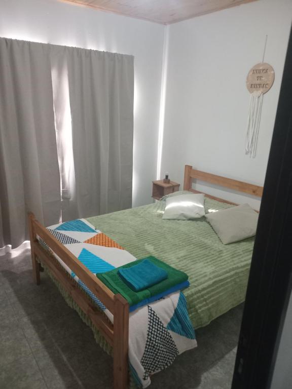 Ένα ή περισσότερα κρεβάτια σε δωμάτιο στο Cabañas Emilia