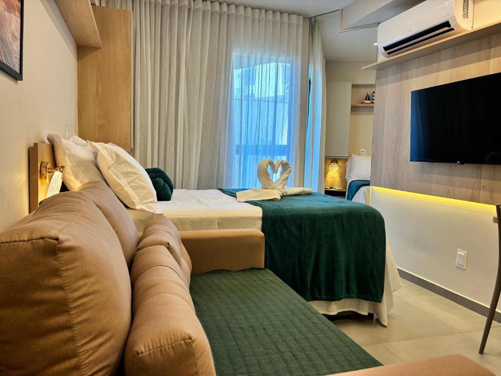 Postel nebo postele na pokoji v ubytování Flat em Porto de Galinhas com Varanda, Aconchegante, Próximo ao Mar e ao Centro Comercial