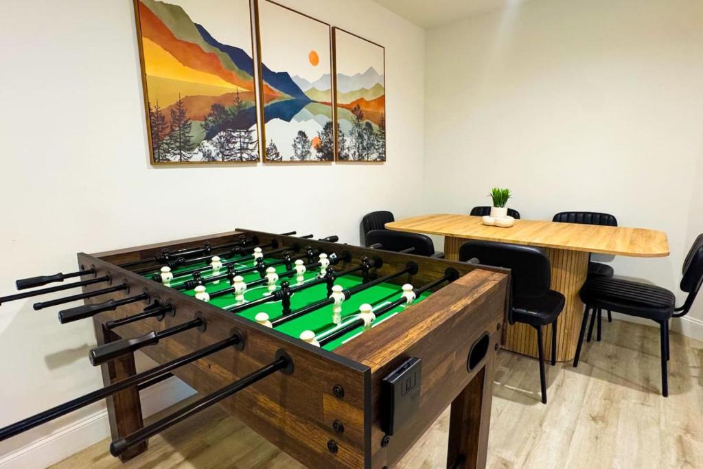 a large wooden foosball table in a room at Waterfront home with Firepit and Foosball Table in Fruitland Park