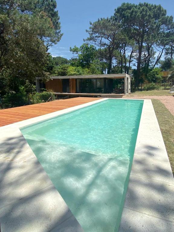 a rendering of a swimming pool with a house at Terrazas del Bosque in La Pedrera