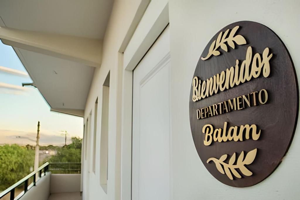 a sign on the side of a building at Depas WAICURA'S in Loreto