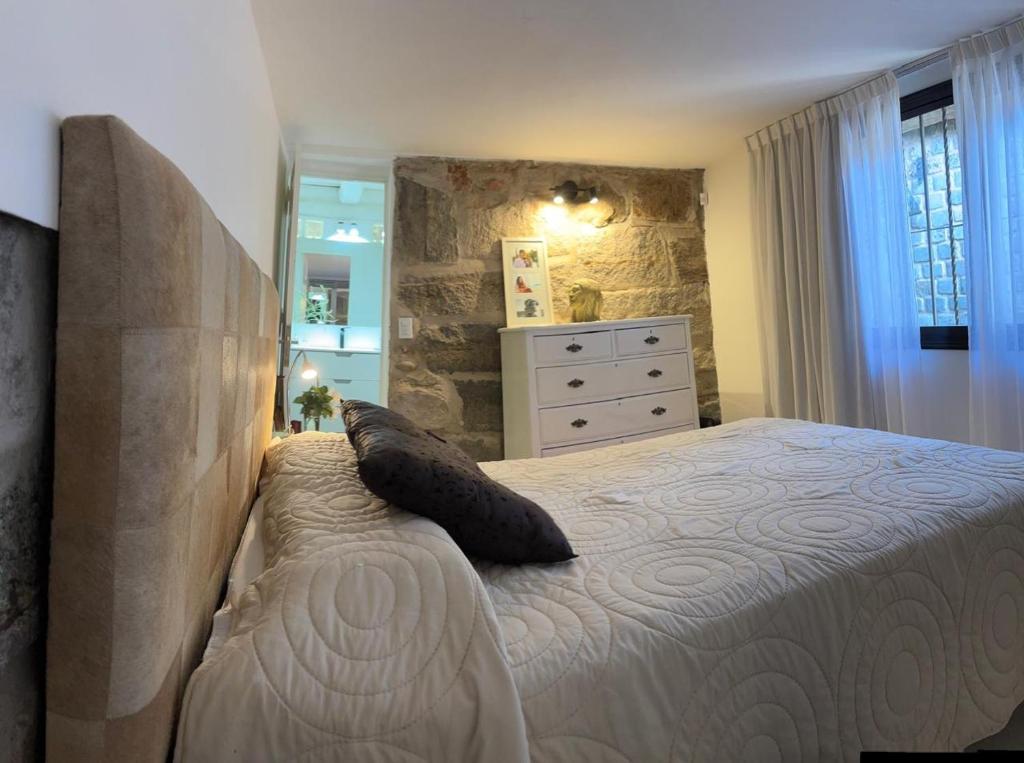 En eller flere senge i et værelse på Casa Campo La Carolina