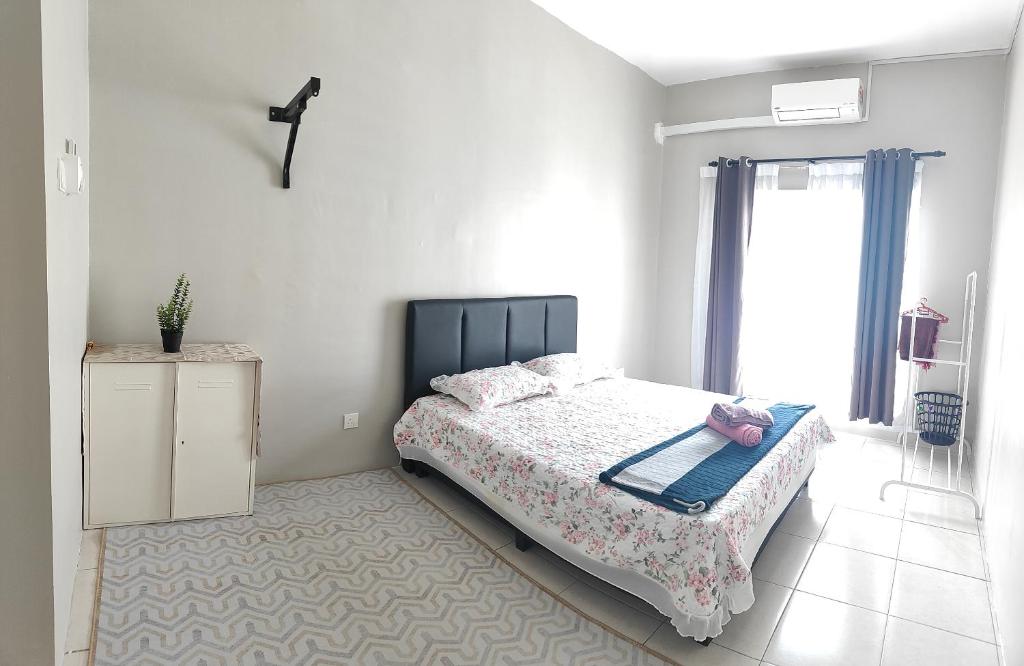 Giường trong phòng chung tại HS Homestay Casa Klebang Ipoh