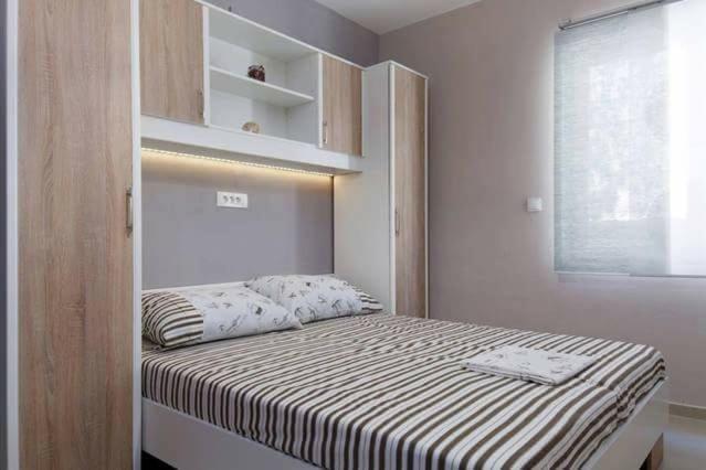 Postel nebo postele na pokoji v ubytování Apartments Romantica