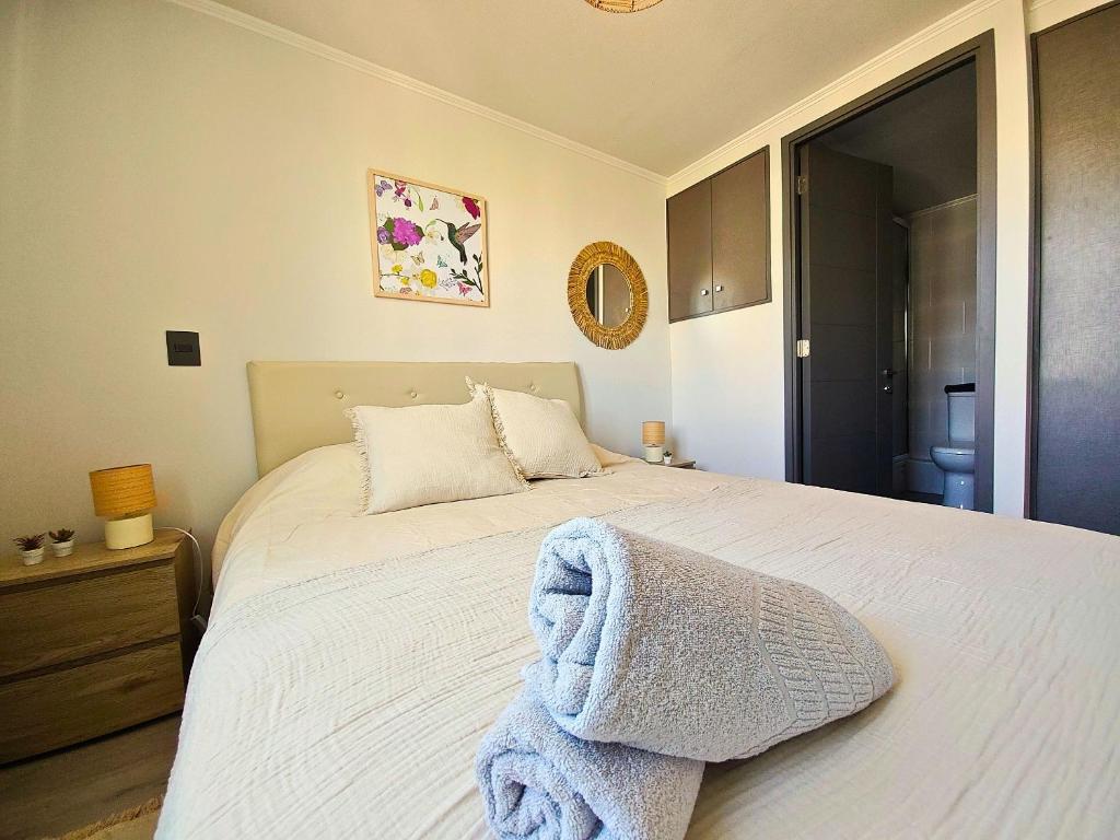 Postel nebo postele na pokoji v ubytování Sierra Ñuñoa Suite