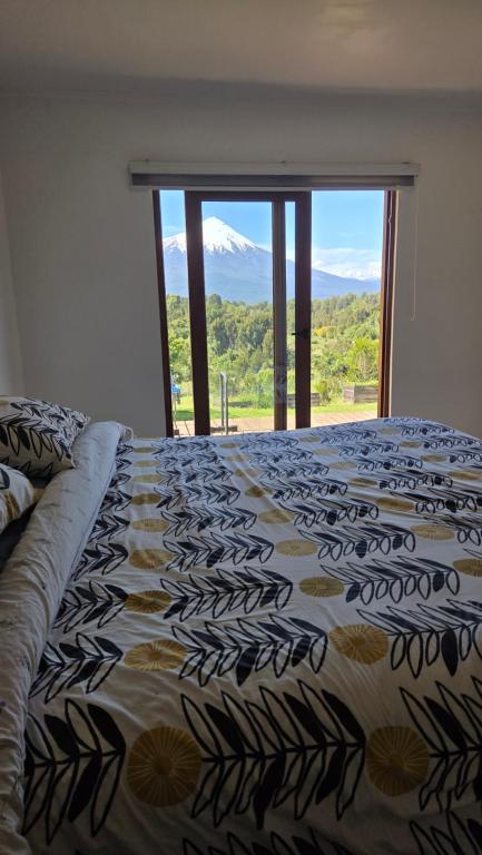 Ένα ή περισσότερα κρεβάτια σε δωμάτιο στο Casa Vulkaan