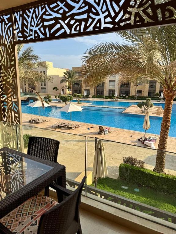 a balcony with a view of a swimming pool at Mangrove M1-5B-13 in Hurghada