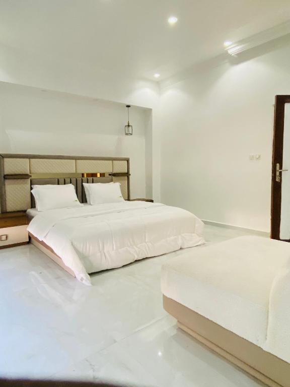 Postel nebo postele na pokoji v ubytování Villa adventureskribi