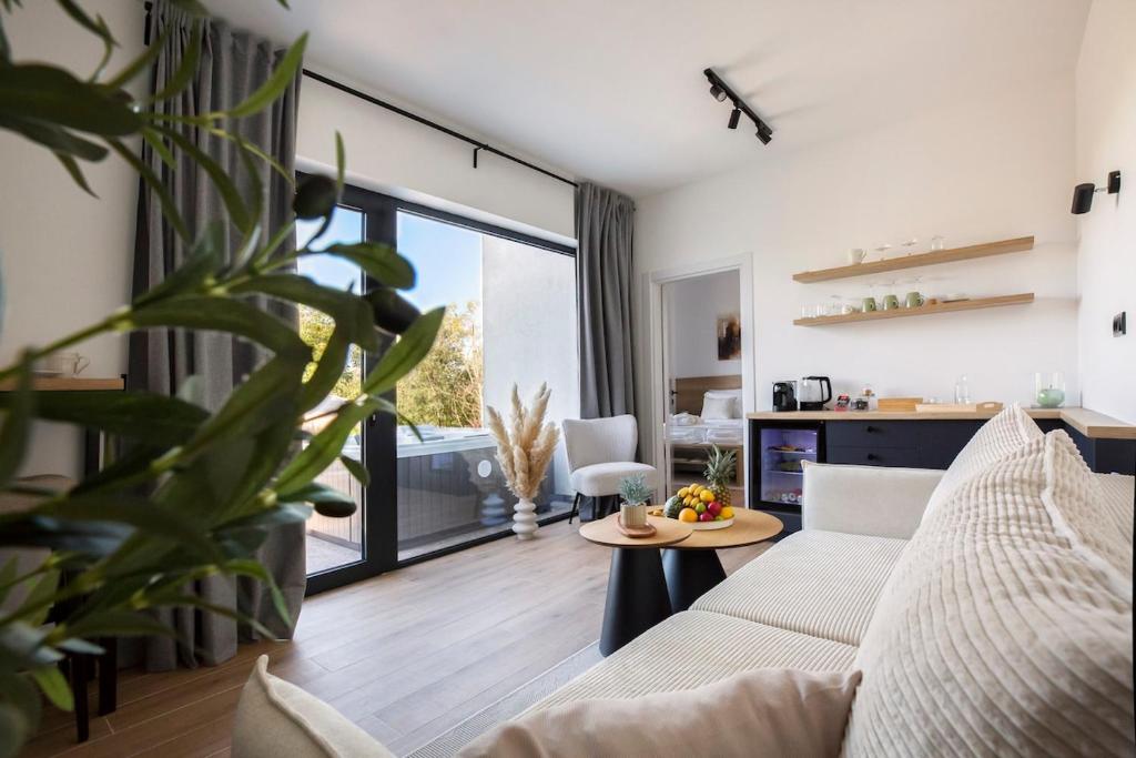 a living room with a couch and a table at Green Valley Accommodation in Lipovica