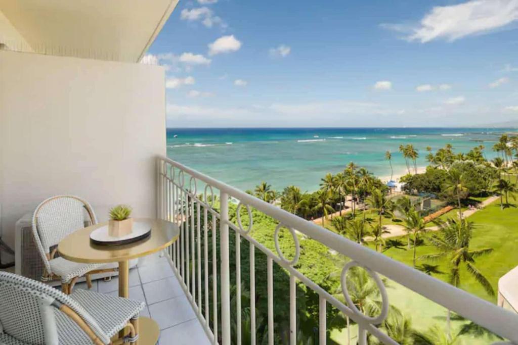a balcony with a view of the ocean at Waikiki Shore 1014 in Honolulu