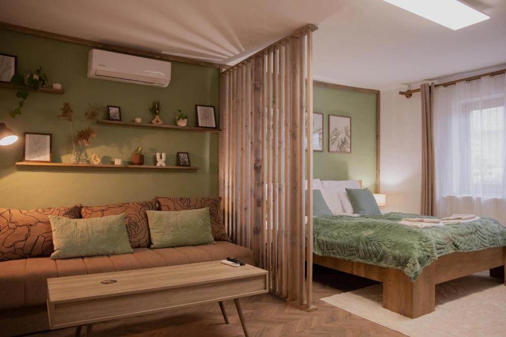 Postel nebo postele na pokoji v ubytování Árnyaskert Vendégház