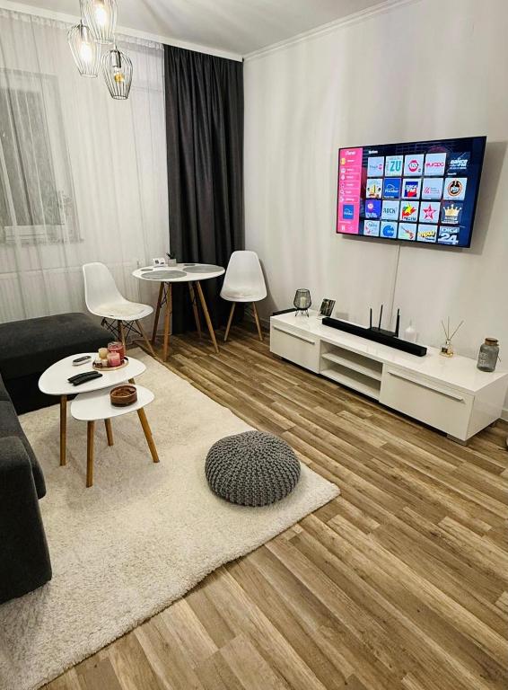 TV a/nebo společenská místnost v ubytování Gabone residence