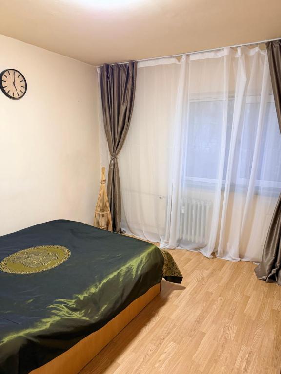 Ένα ή περισσότερα κρεβάτια σε δωμάτιο στο RIN Apartament