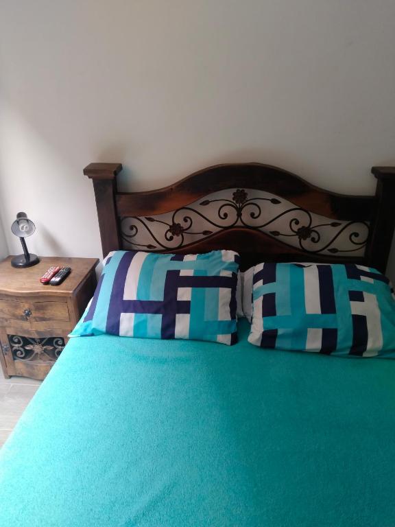 Postel nebo postele na pokoji v ubytování Loft Amplio Primer piso Zona Norte Armenia