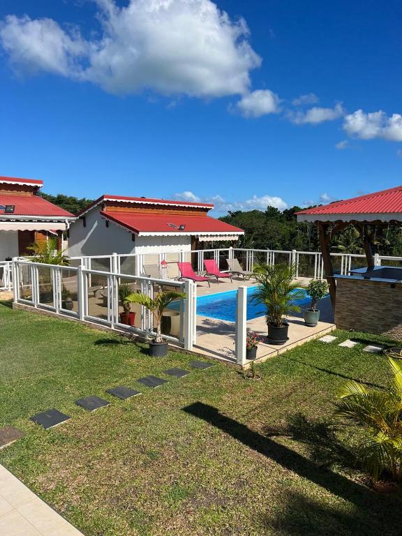 a view of a house with a swimming pool at Le Doux Paradise- CORO in Sainte-Rose
