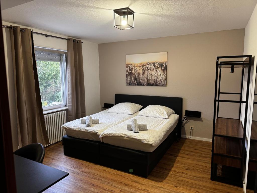Postel nebo postele na pokoji v ubytování 70qm Apartment mit Stellplatz und Garten