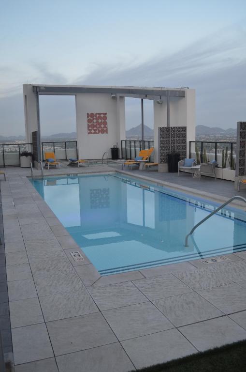a swimming pool on the roof of a building at 2bd 2bth Highrise in the heart of Roosevelt District! in Phoenix