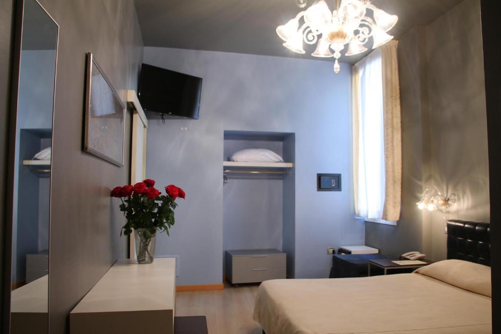 Postel nebo postele na pokoji v ubytování Albergo al Tiepolo
