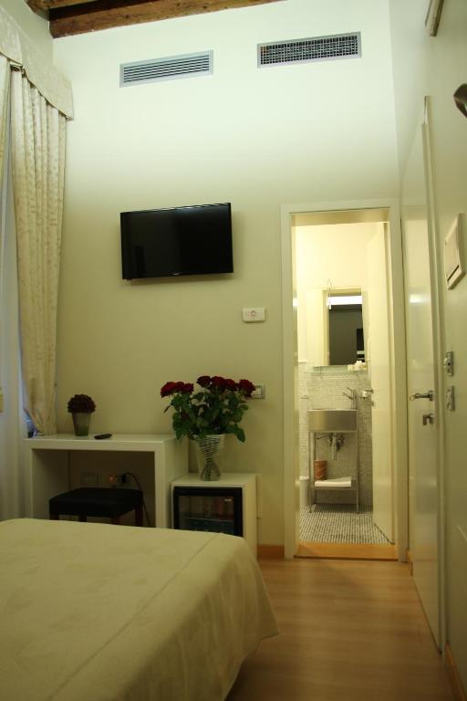 Postel nebo postele na pokoji v ubytování Albergo al Tiepolo
