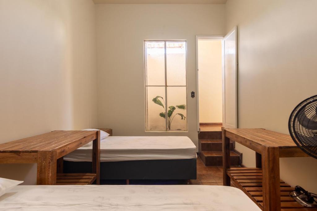 Ένα ή περισσότερα κρεβάτια σε δωμάτιο στο Casa 6 Quartos em Contagem - Ótima para Grandes Grupos