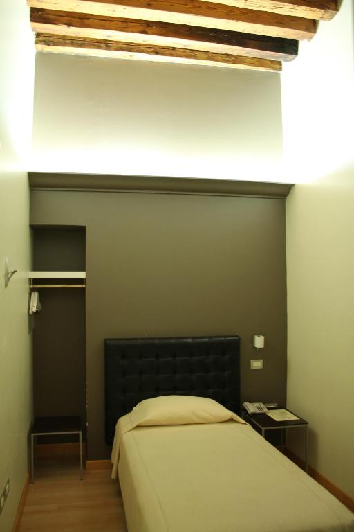 Postel nebo postele na pokoji v ubytování Albergo al Tiepolo